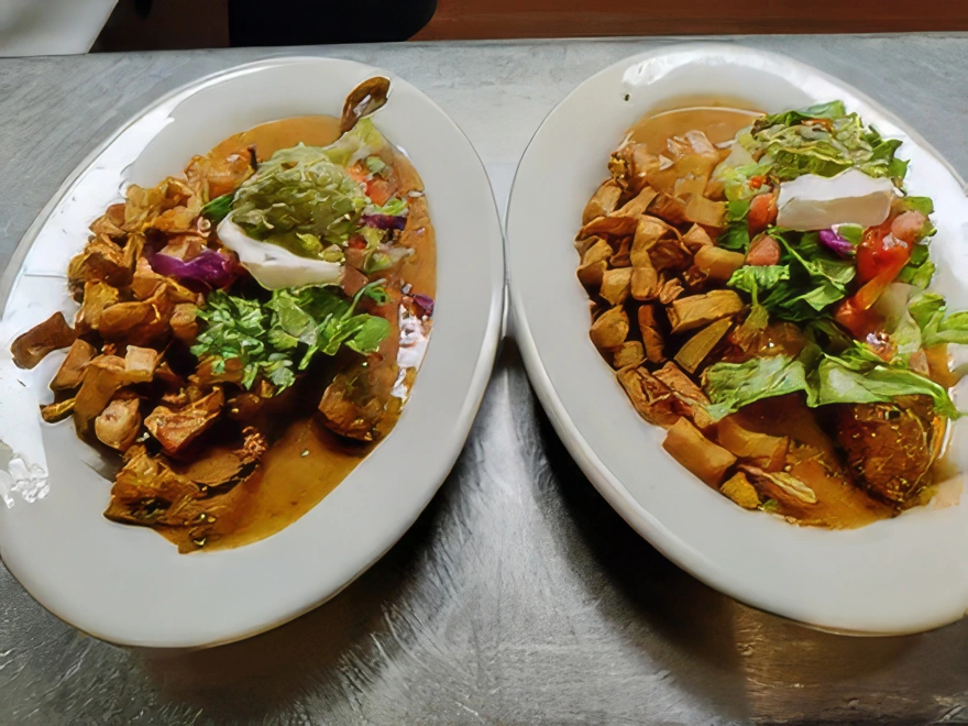 Ala Carte Crispy Chile Relleno Coated in panko bread crumbs, smothered in chile verde or enchilada sauce and topped with lettuce, tomato, sour cream, and guacamole.