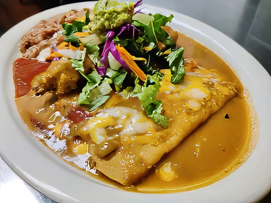 Ala Carte Enchiladas (2) Smothered in chile verde or enchilada sauce and topped with cheddar and Monterey Jack cheese, lettuce, tomato, sour cream, and guacamole.