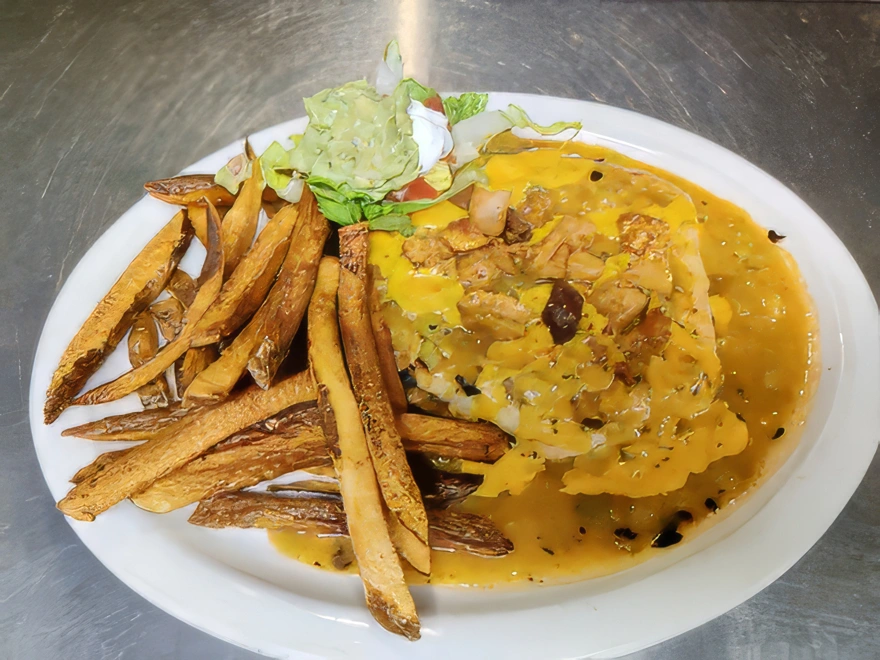 Mexican Hamburger A sirloin beef patty and a generous serving of refried beans inside a large flour tortilla and smothered in chile verde or enchilada sauce. Topped with cheddar and Monterey jack cheese and garnished with lettuce, tomato, sour cream, and guacamole. Served with fresh cut french fries.