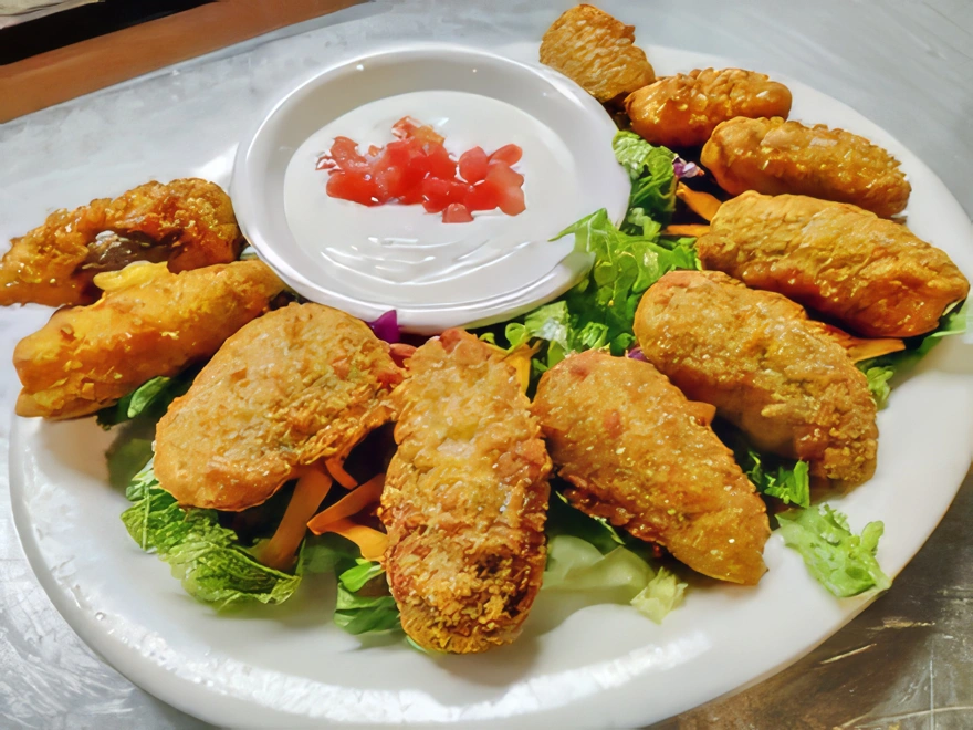 Stuffed Jalapenos Appetizing bite sized breaded jalapenos, stuffed with cheddar cheese and served with a side of ranch dressing
