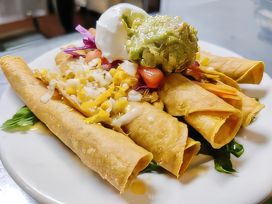 Taquitos Rolled tacos filled with mouthwatering shredded chicken or shredded beef, and served with sour cream and our very own homemade guacamole