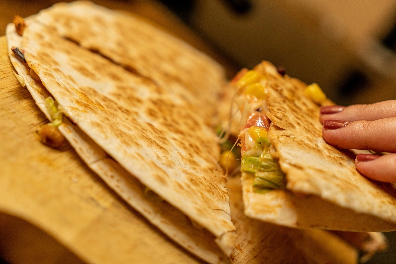 Kids Quesadilla Monterey jack and cheddar quesadilla served with a side of spanish rice, fideo, or refried beans.