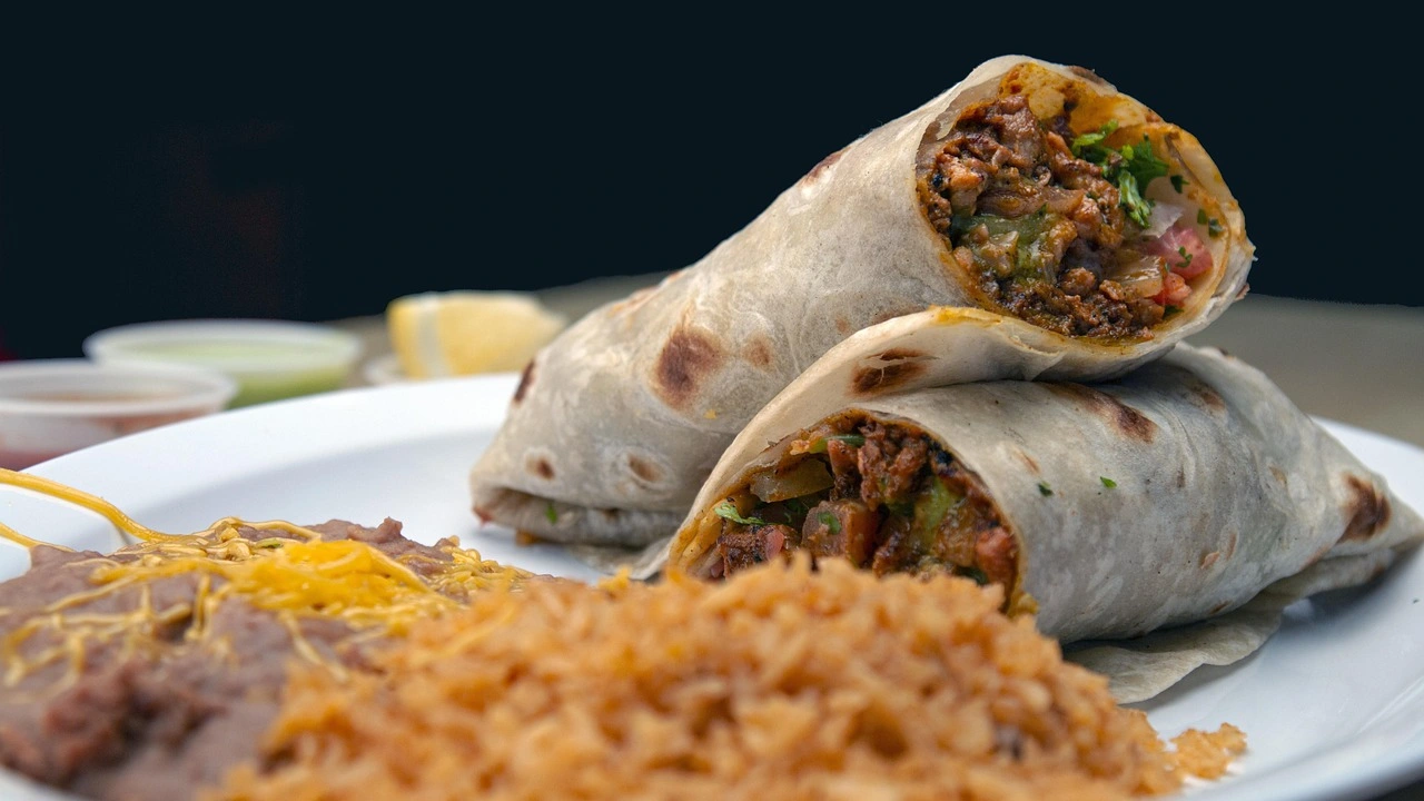 Kids Burrito Plate Refried beans and cheese rolled in a flour tortilla and served with a side of spanish rice, fideo, or refried beans.